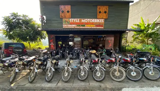 A row of motorcycles for sale outside Style Motorbike's shop in Ha Giang