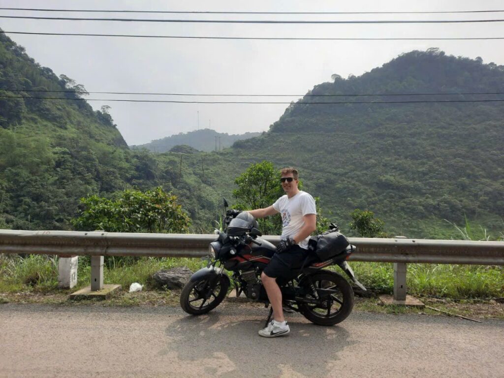 Customer and Honda CB150X adventure bike in the mountains