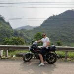Customer and Honda CB150X adventure bike in the mountains