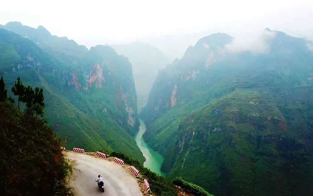 Ha Giang Loop: Why Bike Quality Matters (Your Safety Guide) 1 honda xr driving the ma pi leng pass in ha giang