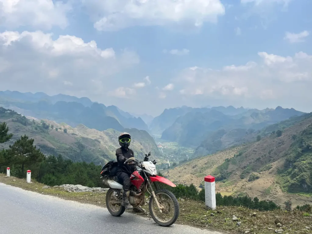 Ha Giang Loop: Why Bike Quality Matters (Your Safety Guide) 7 honda xr in ha giang with mountain views and wearing protection
